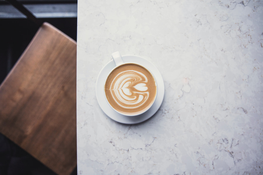 Flat white coffee in a marble table