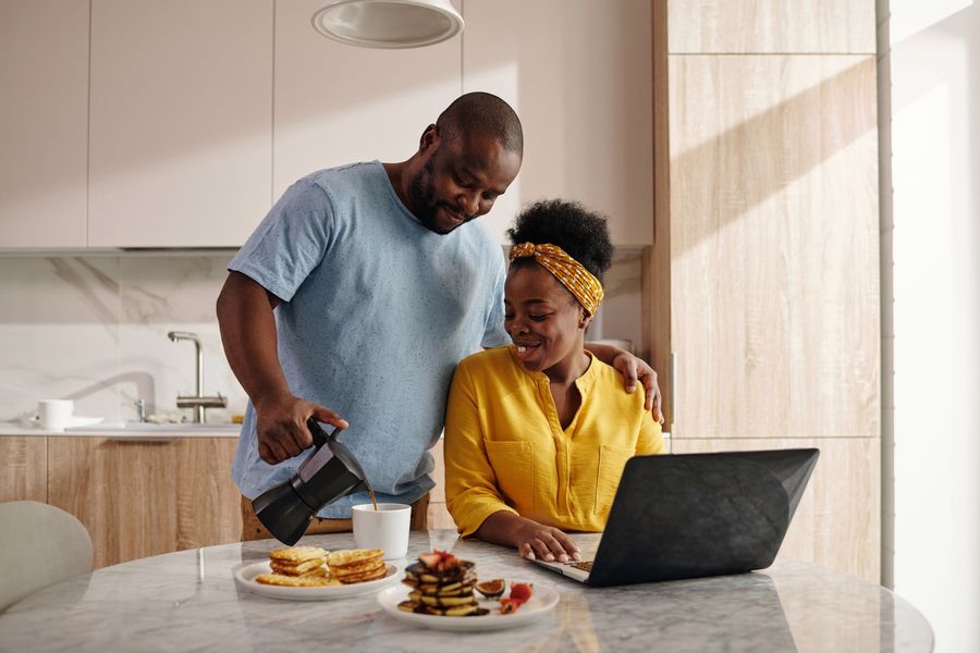 Husband pouring his wife a cup of decaf coffee