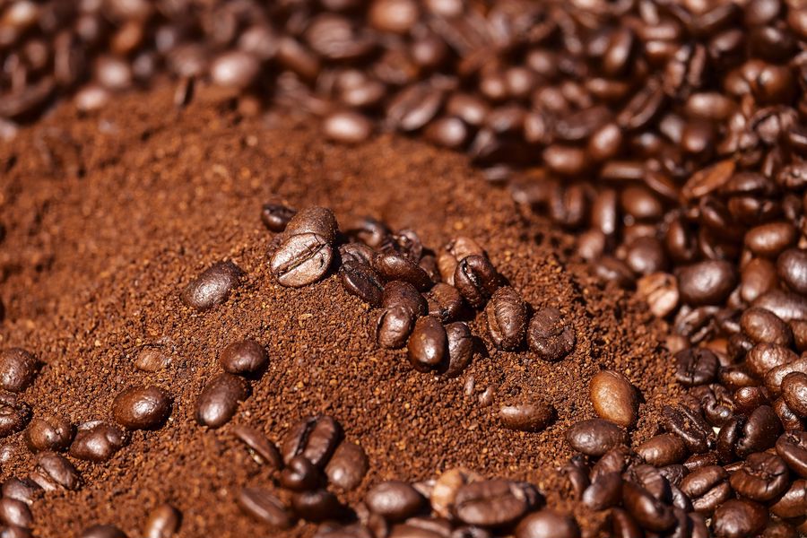 Ground coffee mixed with coffee beans