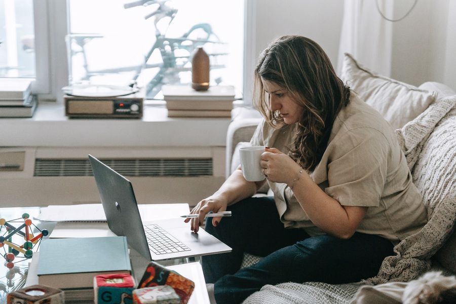 Woman realizing that her coffee tastes like water