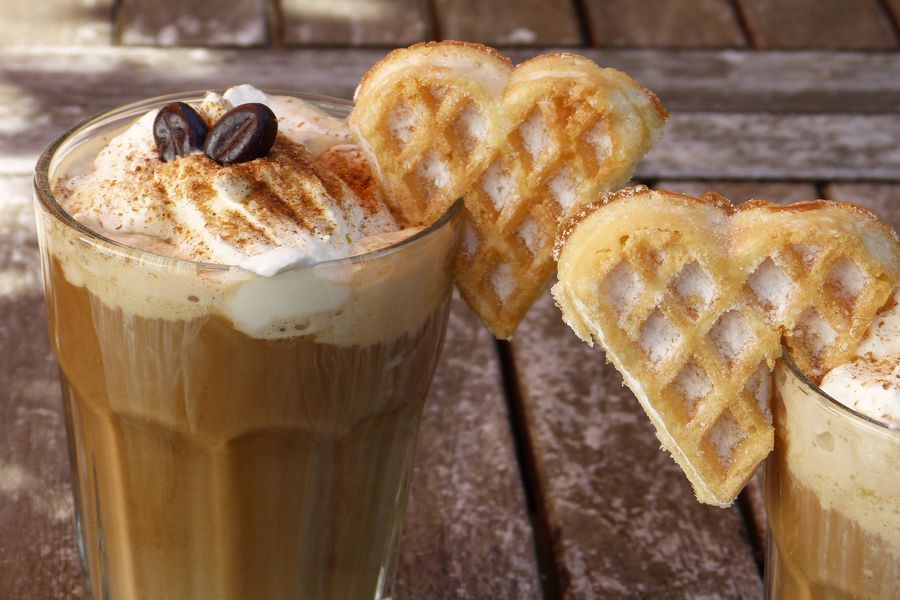 French vanilla coffee with a heart shaped waffle on the side