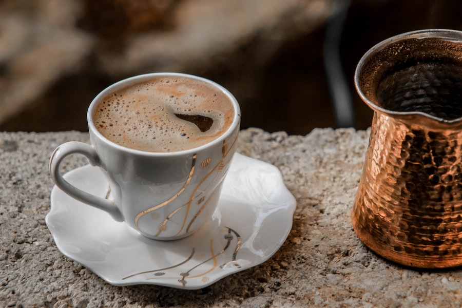 Coffee in a white porcelain mug and plate