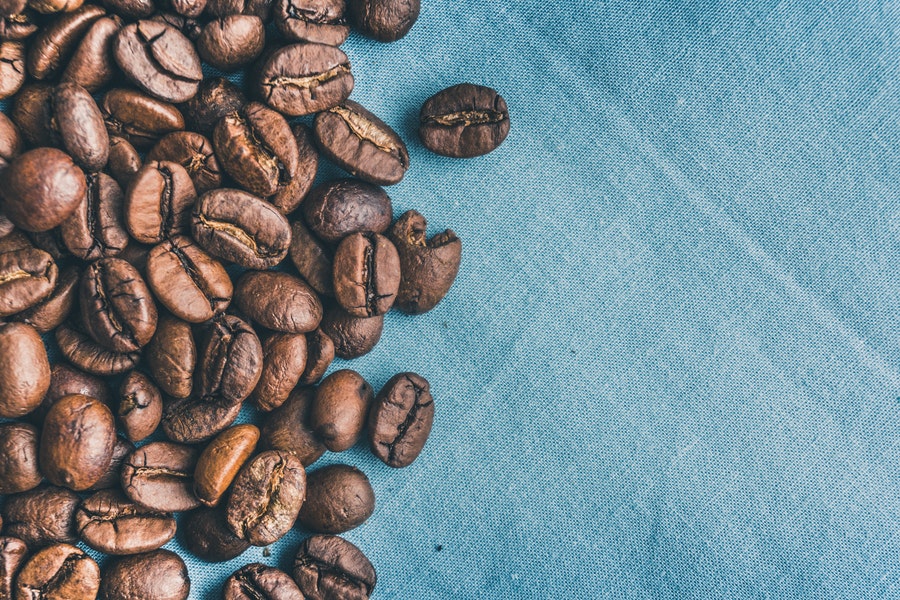 Coffee beans on a blue cloth