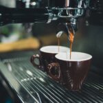 Filling coffee in mugs
