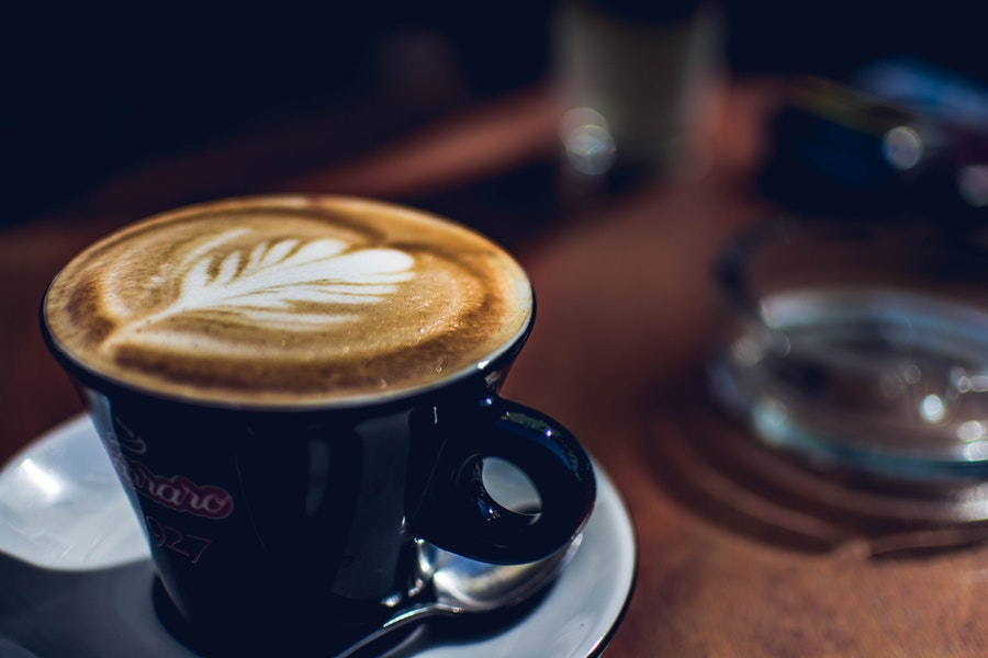 Coffee art in dark mug