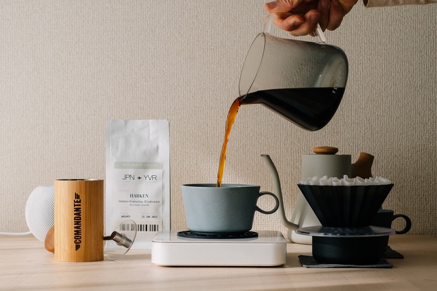 Pouring coffee over the mug