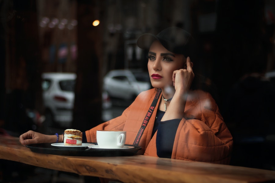 Woman drinking coffee alone