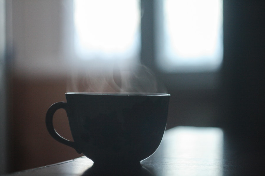 Hot coffee in a black mug