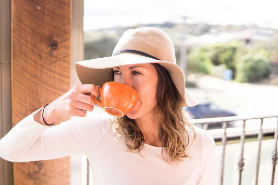 a person drinking coffee to keep her awake