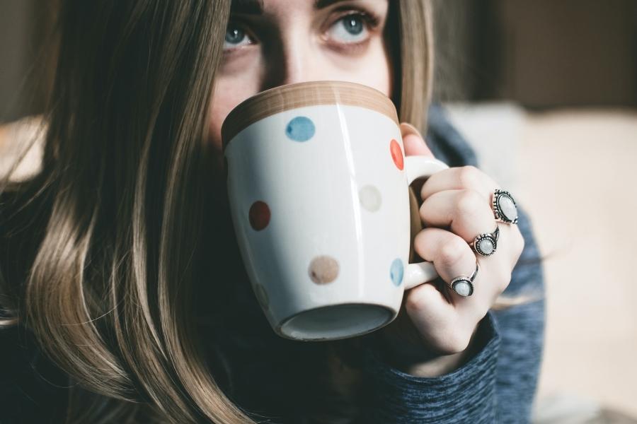 A person showing what kind of coffee she will drink to keep her awake