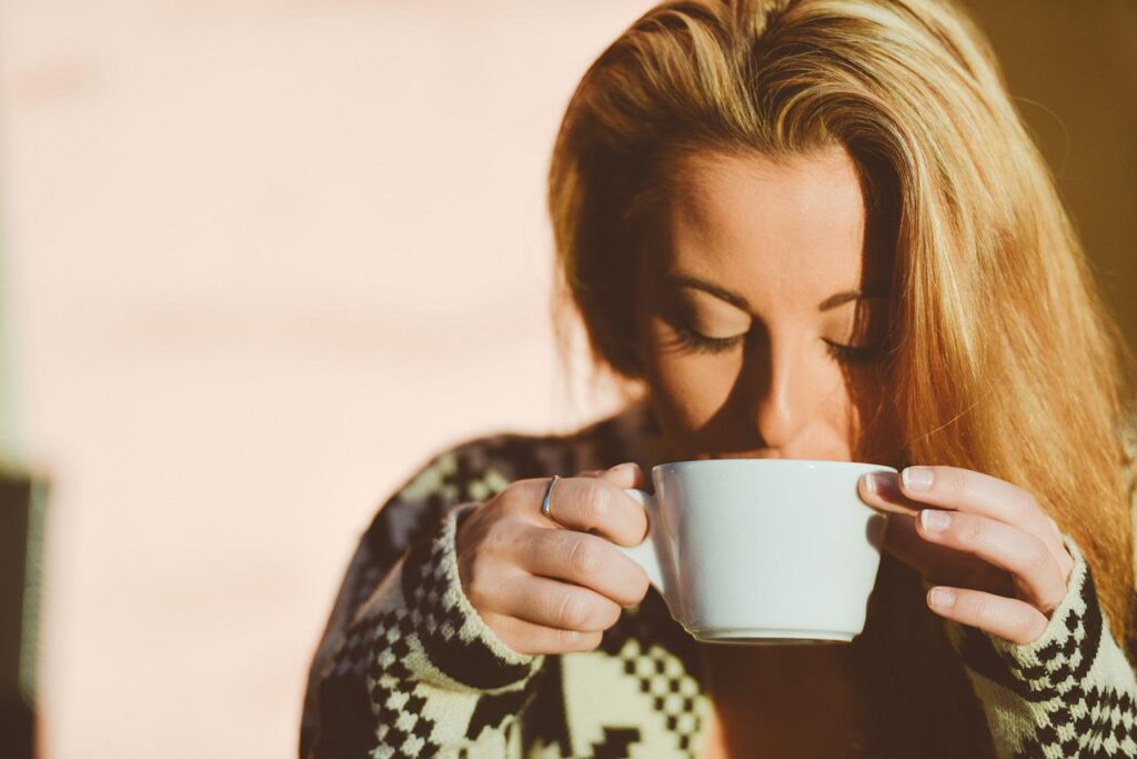 A person checking why does her coffee taste salty