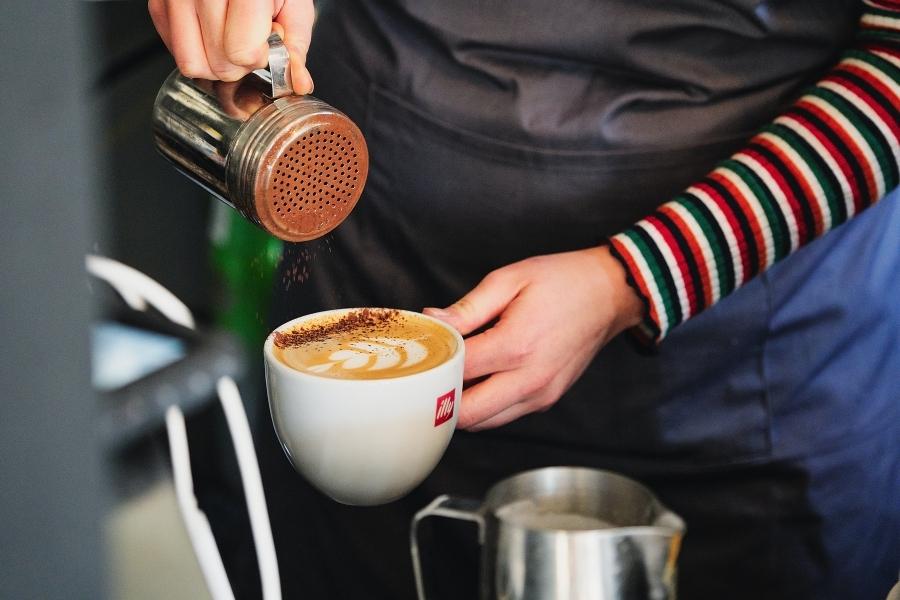 A barista making and espresso