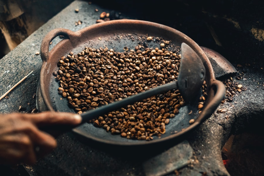 Coffee beans on a cooking pot