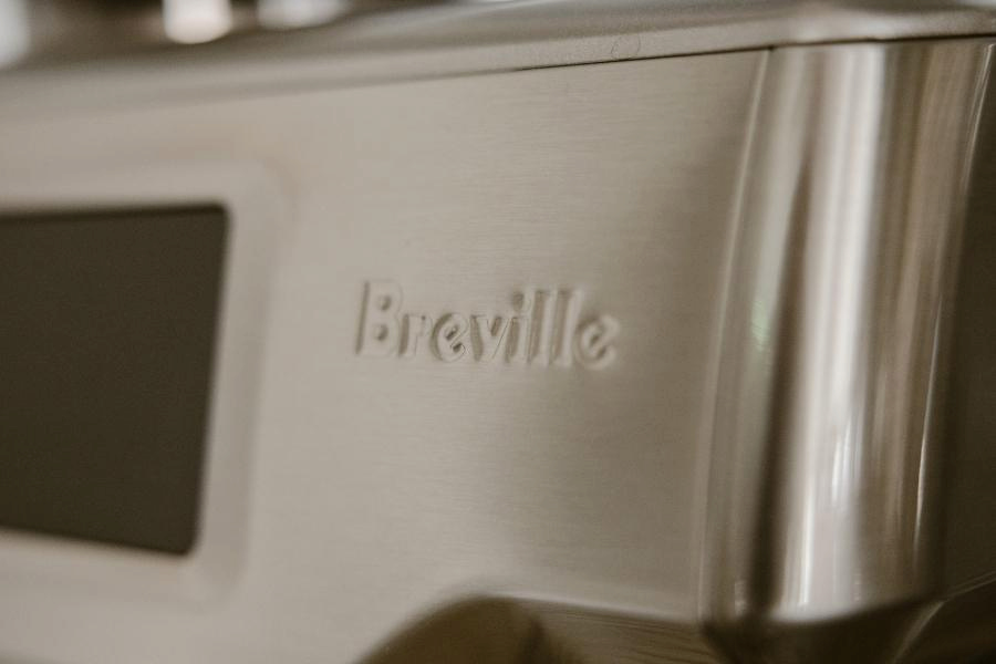 A clean and close-up Breville silver coffee machine