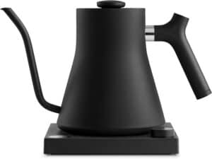 Sleek black electric kettle on a matching base, designed for quick and easy boiling of coffee or tea, perfect for modern kitchen routines.